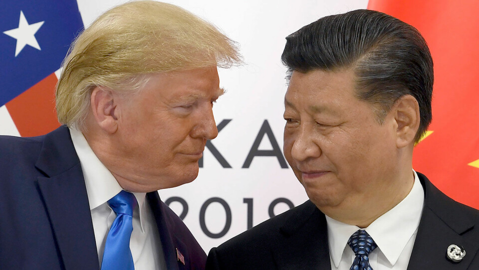 BILKONGER: USAs handelskrig med Kina har kraftig påvirket bilsalget i verdens mest folkerike land. Her er presidentene Donald Trump og Xi Jinping under forrige sommers G20-møte i Osaka. Foto: NTB / AP